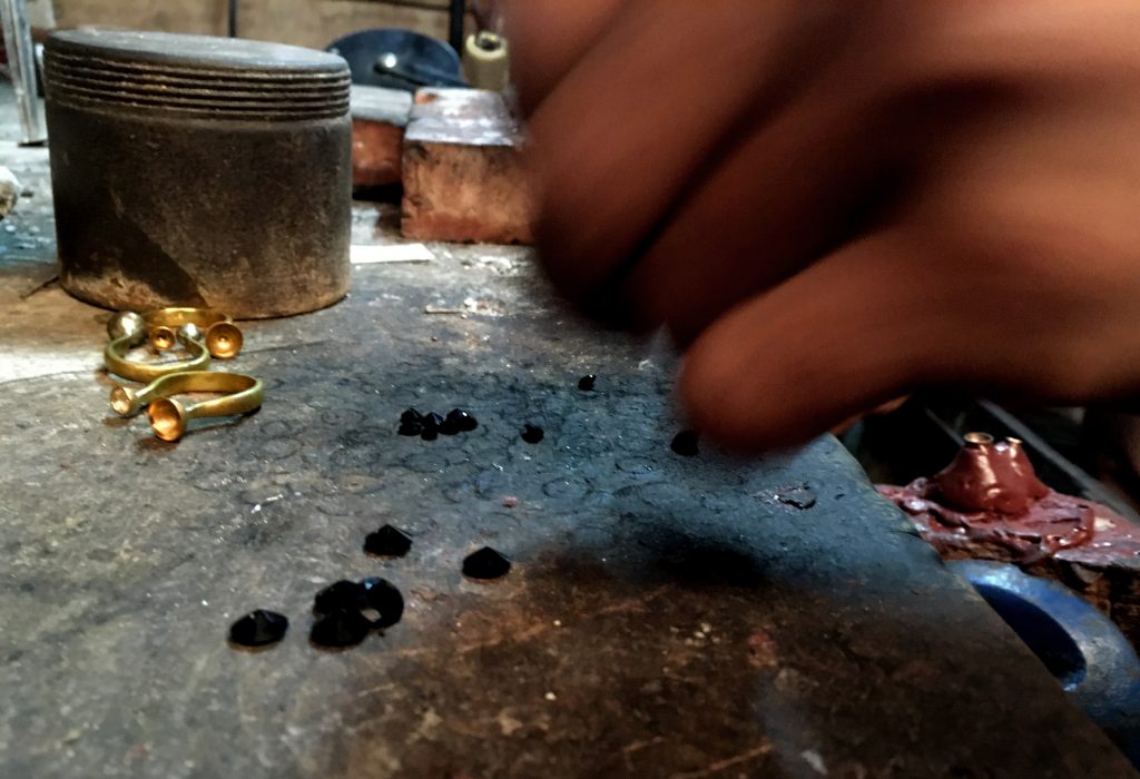 artisan making rings