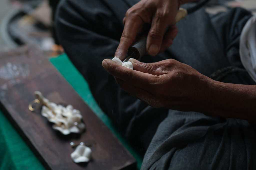 Hand making a flower.