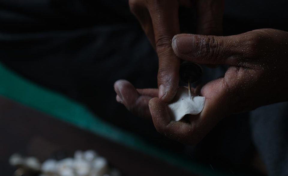 hands carving flower