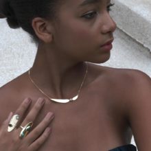 Black model with jewellery.